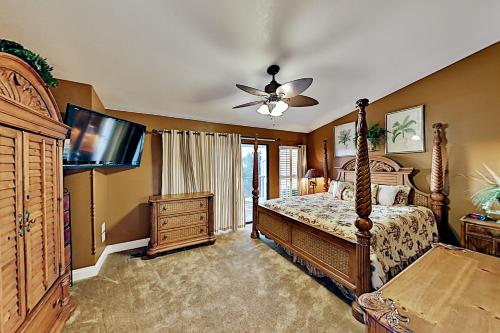 a bedroom with a bed and a ceiling fan at Mainsail IV in Destin