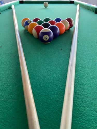 a snooker table with a group of balls on it at Tisza Sport Hotel in Szeged