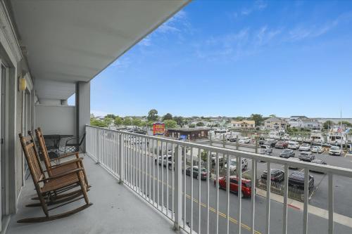 a balcony with a chair and a view of a street at Mariners Watch 205 in Ocean City