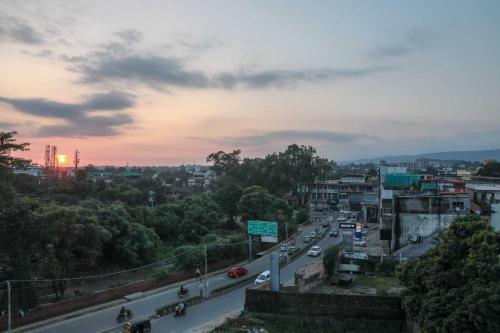 a busy city street with cars on a highway at Hotel Alaya in Dehradun