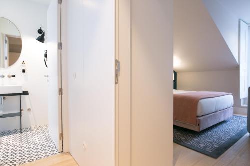 Кровать или кровати в номере The Lift Apartments by RIDAN Hotels