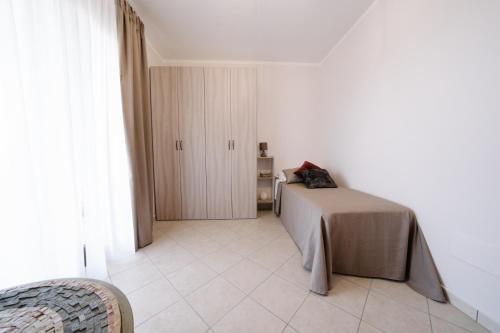 a bedroom with a bed and a room with a door at Agriturismo Tenuta Don Carlo in Nocera Superiore