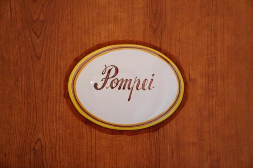 a plate with the word samurai on a wooden wall at Agriturismo Tenuta Don Carlo in Nocera Superiore