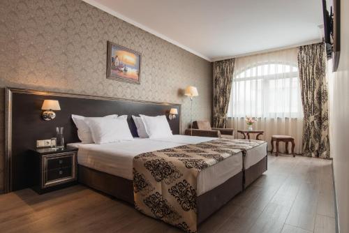 Llit o llits en una habitació de Hotel & SPA Diamant Residence - All Inclusive