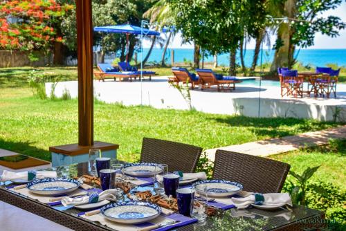 a table with plates of food on top of it at Tamarind Tree Zanzibar in Mazizini