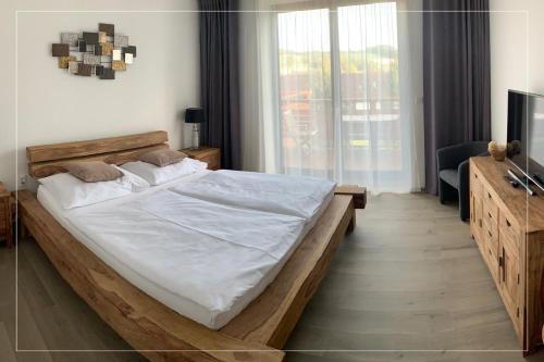 Кровать или кровати в номере Wellness penzion Marta