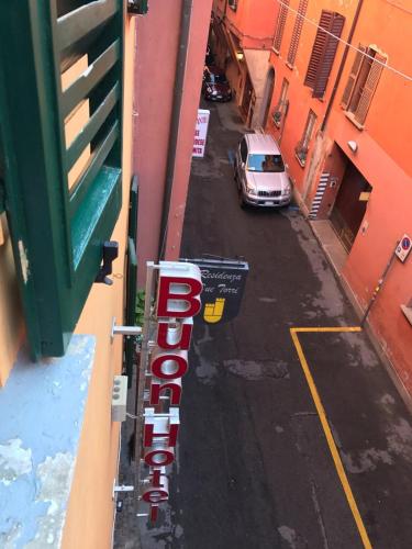 a view of a street with a car parked on the road at Buon Hotel Bologna Centro - Affittacamere - Self Check-In in Bologna