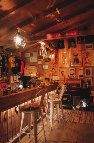 a bar with two chairs sitting at a counter at Fain in Lunca Bradului