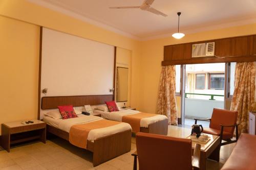 Postel nebo postele na pokoji v ubytování Sea Green Hotel