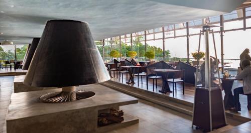 a lamp sitting on a table in a restaurant at Casa 1800 Cerro Verde in Cerro Verde