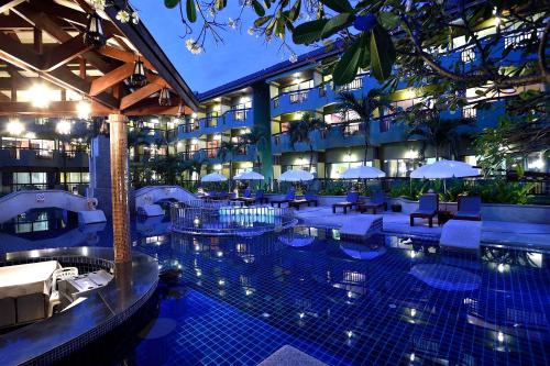 a large swimming pool in a hotel room at Phuket Island View - SHA Extra Plus in Karon Beach