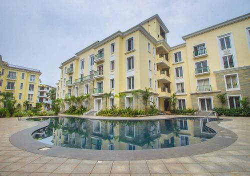 The swimming pool at or close to ComfyCorner - Luxurious 2-BHK Apartment