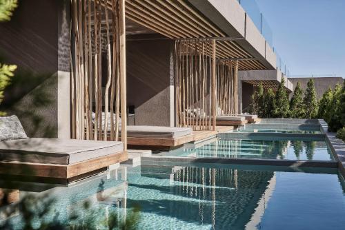 Piscina de la sau aproape de NEMA Design Hotel & Spa - Adults Only