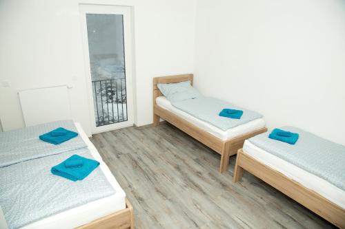 A bed or beds in a room at Apartmán Pod Klepáčem