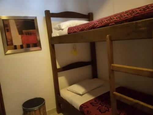 Postel nebo postele na pokoji v ubytování Hostal Macondo Inn