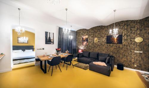 a living room with a couch and a table at Silvie Apartments - Blažejský in Olomouc