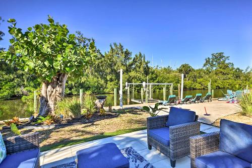a group of chairs sitting on a patio at Waterfront Bradenton Home Heated Pool and Fire Pit in Bradenton