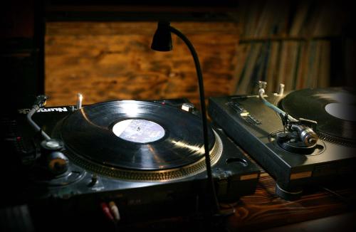 a vinyl record sitting on top of a table at Gangneung Guesthouse Myu in Gangneung