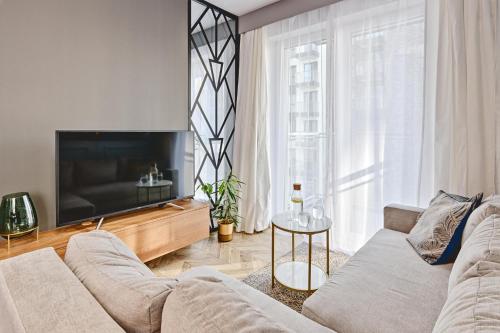 Телевизор и/или развлекательный центр в ApartHouse Fabryczna