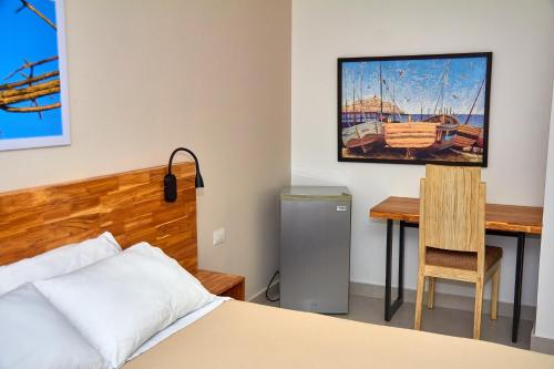 Hotel Torre del Prado tesisinde bir odada yatak veya yataklar