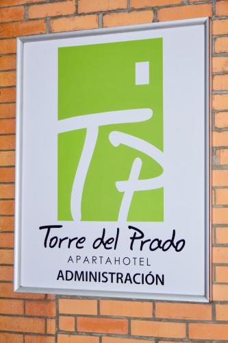 a sign on a brick wall with the namerence el rock applied architectural administration at Hotel Torre del Prado in Barranquilla