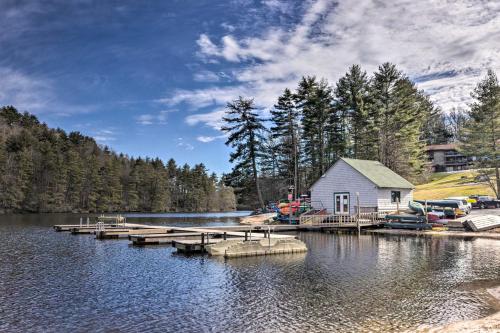 a house on a dock on a lake at Rustic-Chic Sapphire Home with Wraparound Decks in Sapphire