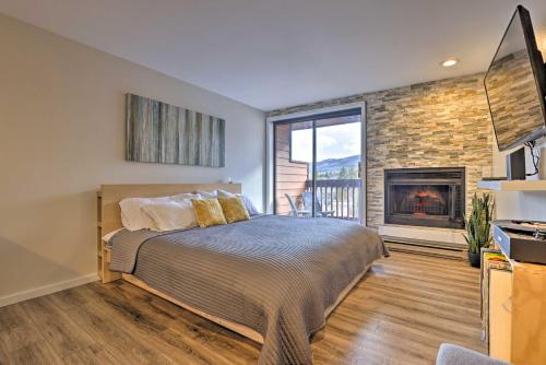 a bedroom with a bed and a fireplace at Modern Frisco Studio Walk to Main Street! in Frisco