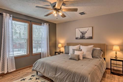 a bedroom with a bed and a ceiling fan at 14 A Getaway Family House with Large Deck! in Sturgis