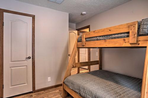 a bedroom with two bunk beds and a closet at Idyllic Sturgis Home with Fire Pit and Large Deck! in Sturgis