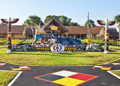 a man jumping over a sign in a parking lot at Miccosukee Casino & Resort in Miami