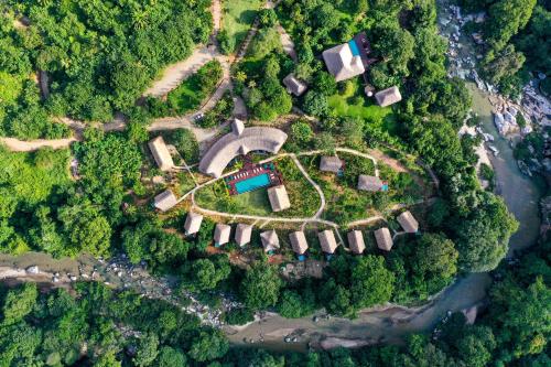 an aerial view of a house in the middle of a forest at Senda Watapuy in El Zaino