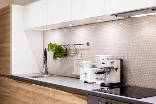 a kitchen with a coffee maker on a counter at Family Apartment in Tallinn
