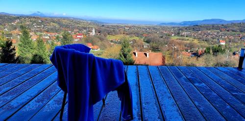 a chair sitting on top of a roof with a view at Tiny House Retreat Bran in Bran