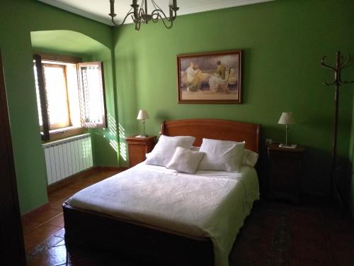 En eller flere senger på et rom på Casa Rural El Granero