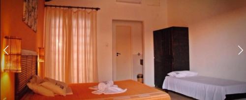 Ein Bett oder Betten in einem Zimmer der Unterkunft Praia do Forte Hostel