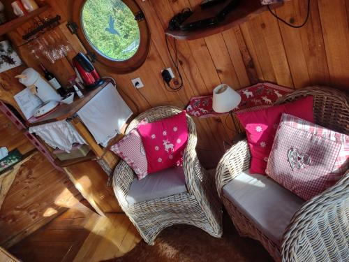 an overhead view of a living room with a couch and chairs at Domaine De La Carrauterie by Terre Insolite in Sautin