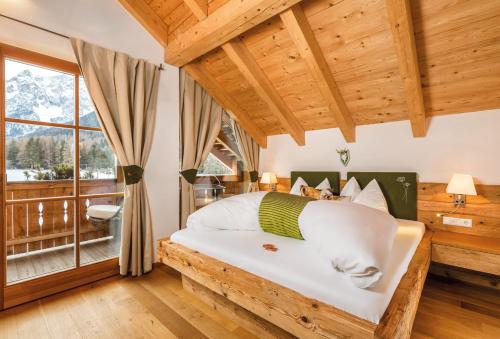 a bedroom with a bed and a window at Naturapartments Schönfeld in Sesto