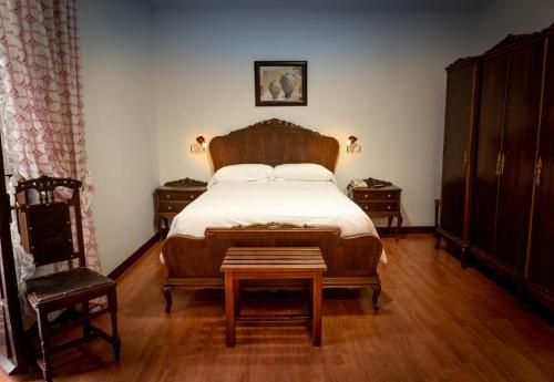 A bed or beds in a room at La Quinta De Santillan