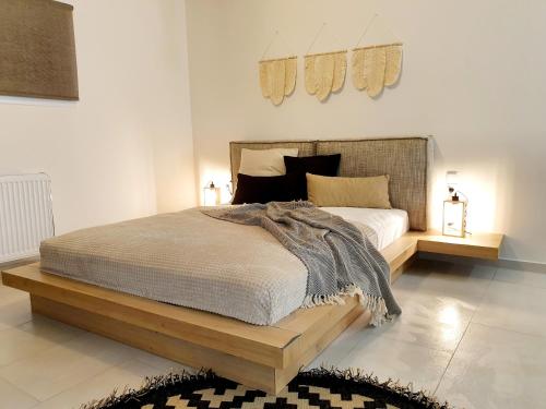 Säng eller sängar i ett rum på Βοho katoikia