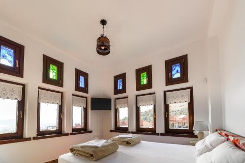 Ένα ή περισσότερα κρεβάτια σε δωμάτιο στο Mansion Chalatsopoulos