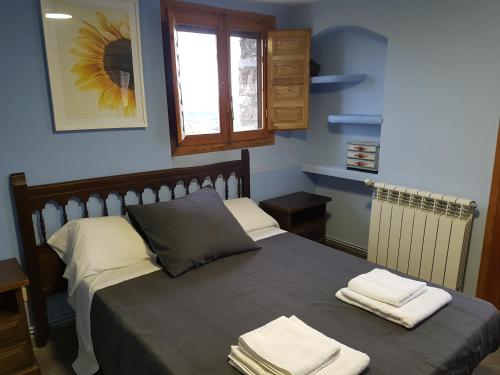 מיטה או מיטות בחדר ב-Casa Martín
