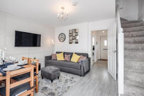 a living room with a couch and a table at Dartford Kent Smart Nest in Dartford