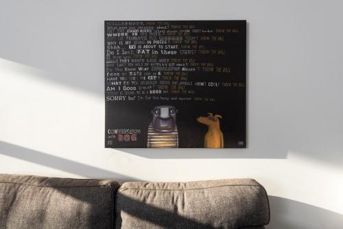 an image of a living room with a picture on the wall at Silver Fern - Lake Tekapo in Lake Tekapo