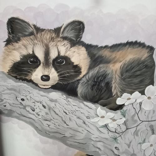 a painting of a raccoon on a tree branch at Три горішки in Yaremche