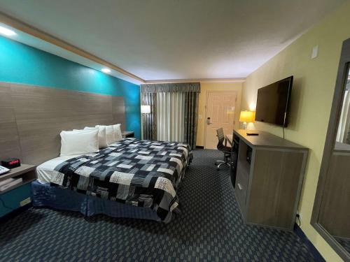 A bed or beds in a room at SureStay Plus Hotel by Best Western Odessa