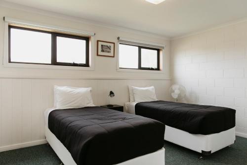 Ένα ή περισσότερα κρεβάτια σε δωμάτιο στο Anchor Wheel Motel