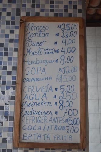 a sign in a bathroom with numbers on the wall at Recanto Novo Horizonte in Recife