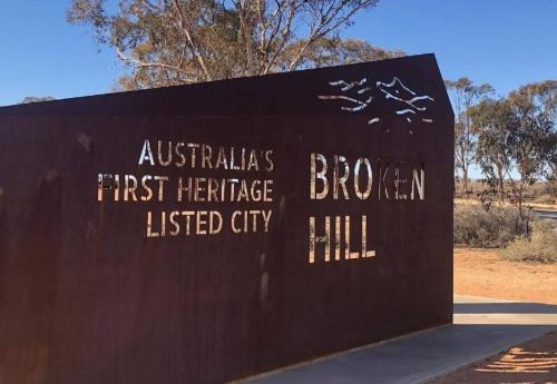 a sign for a bronx first heritage listed city at The Comfort Cottage on Williams in Broken Hill