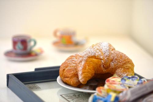 two croissants on a plate on a table at Mamaral in Agerola