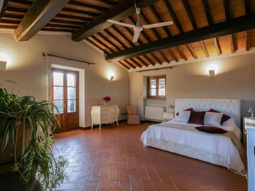 a large bedroom with a bed and a table at Timeless Tuscan Holiday Stay in Arezzo